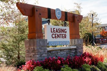 A sign for the leasing center at the club house